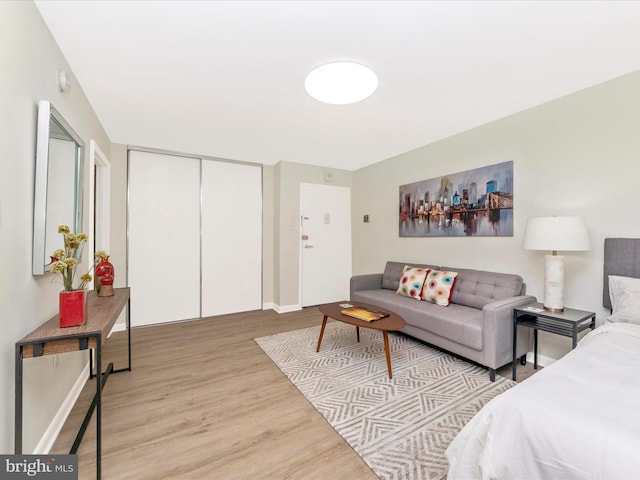 bedroom featuring light hardwood / wood-style floors and a closet