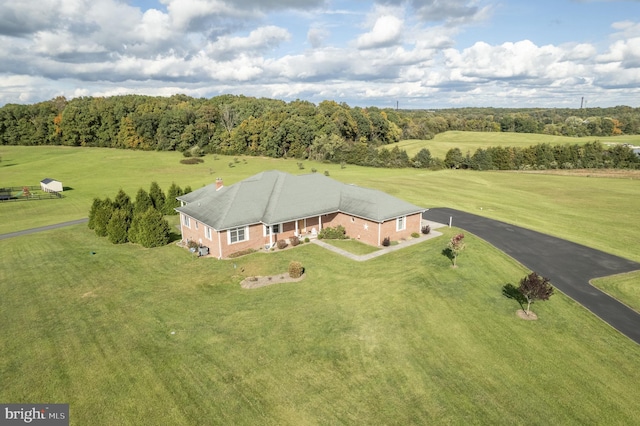 birds eye view of property with a rural view