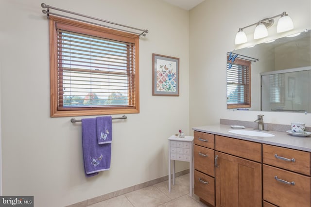 bathroom featuring vanity, walk in shower, and tile patterned floors