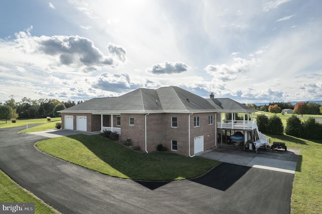 view of property exterior with a yard and a garage