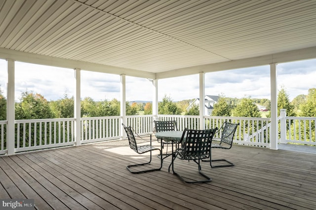 unfurnished sunroom with plenty of natural light