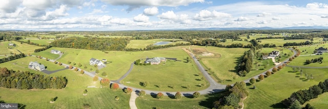 birds eye view of property with a rural view