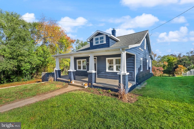 bungalow-style home with a porch and a front lawn