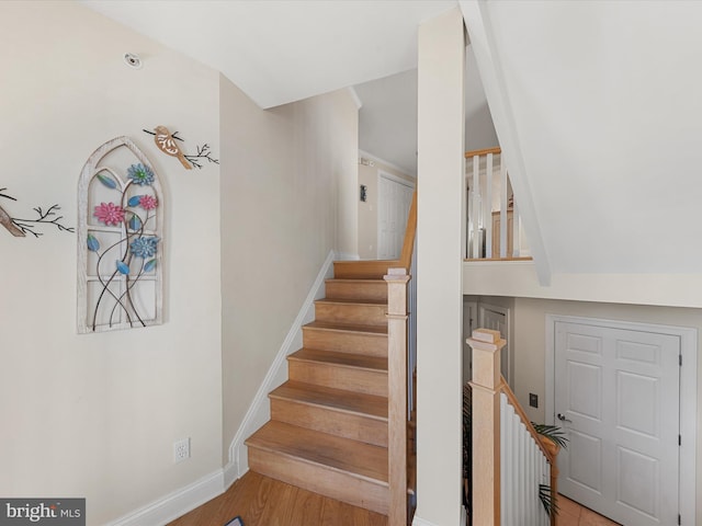 staircase featuring hardwood / wood-style flooring