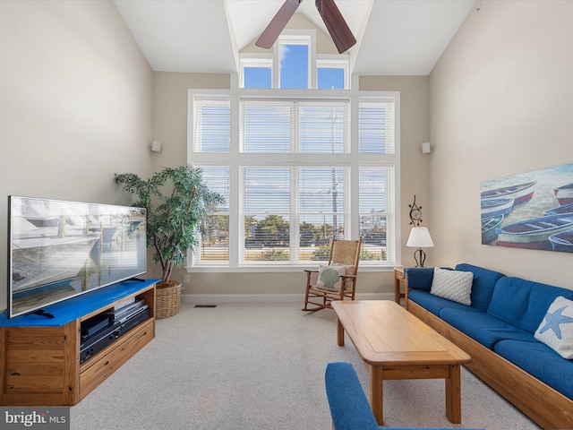 living room with lofted ceiling, carpet flooring, and ceiling fan