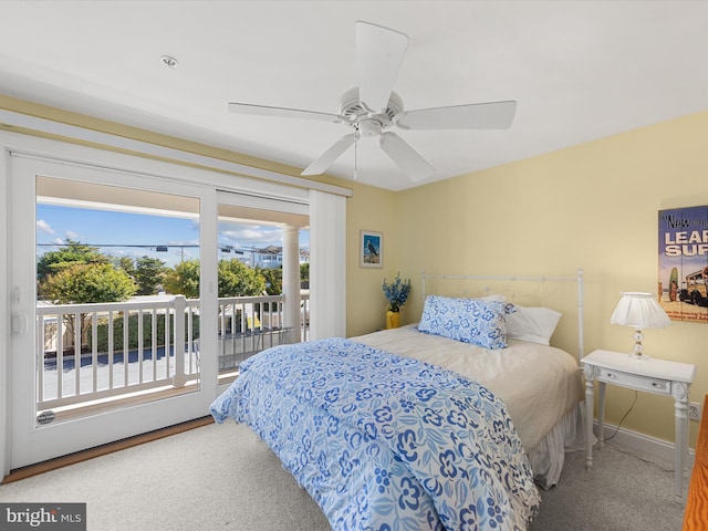 bedroom with carpet, ceiling fan, access to outside, and multiple windows