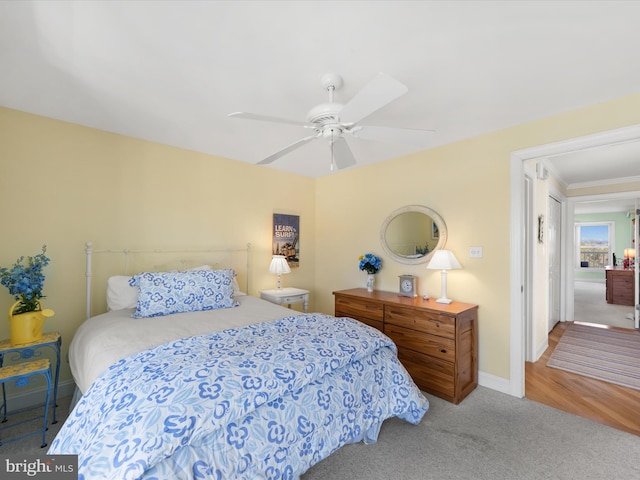 bedroom featuring ceiling fan, crown molding, and carpet