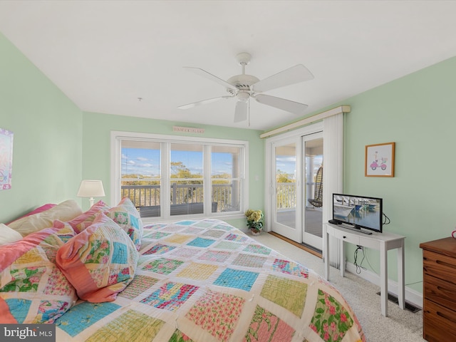 bedroom with access to exterior, light colored carpet, and ceiling fan