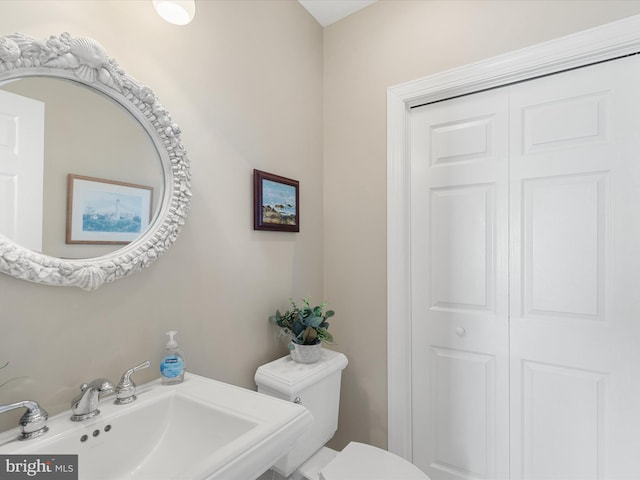 bathroom with sink and toilet