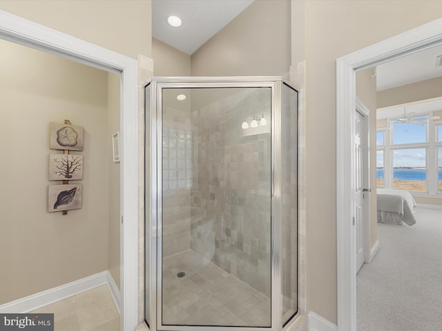 bathroom featuring an enclosed shower and lofted ceiling