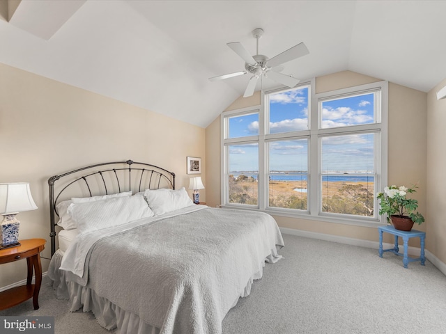 bedroom featuring a water view, ceiling fan, carpet flooring, and lofted ceiling