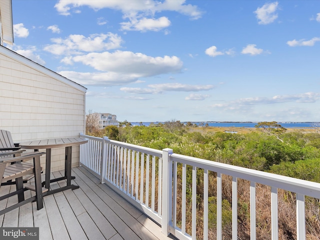 wooden deck with a water view