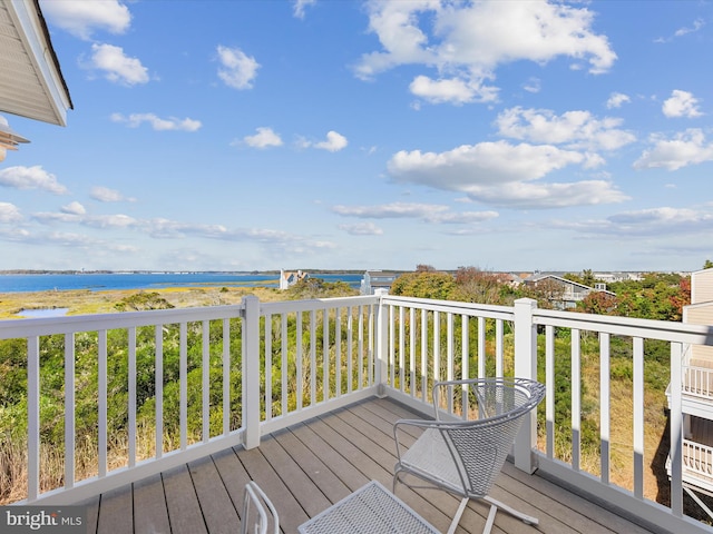 wooden deck with a water view