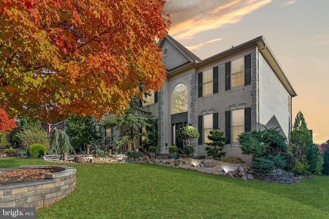 view of front of home with a yard