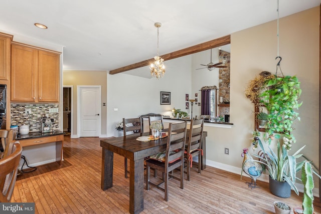 dining room with light hardwood / wood-style flooring and ceiling fan with notable chandelier