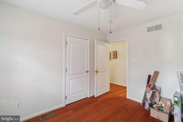 empty room featuring hardwood / wood-style floors and ceiling fan