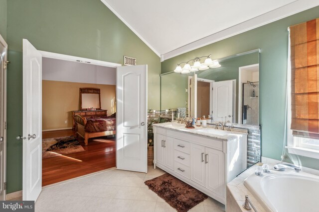 bathroom featuring shower with separate bathtub, tile patterned floors, vanity, crown molding, and high vaulted ceiling