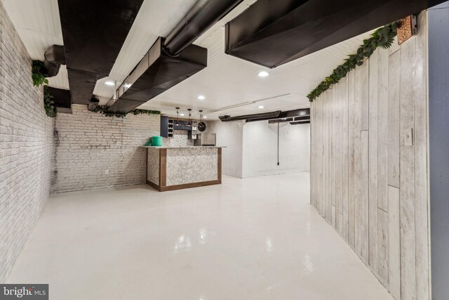 basement with brick wall