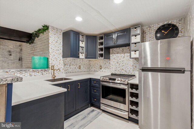 kitchen featuring appliances with stainless steel finishes, sink, and decorative backsplash