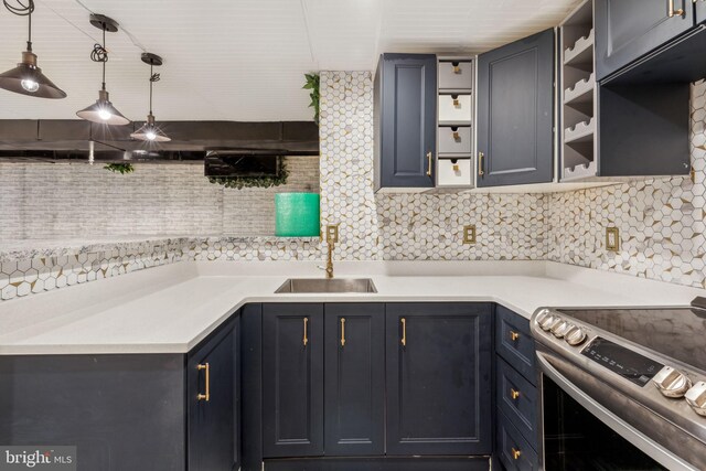 kitchen with tasteful backsplash, stainless steel range with electric cooktop, sink, and pendant lighting