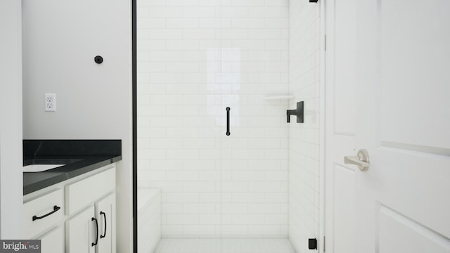 bathroom featuring an enclosed shower and vanity