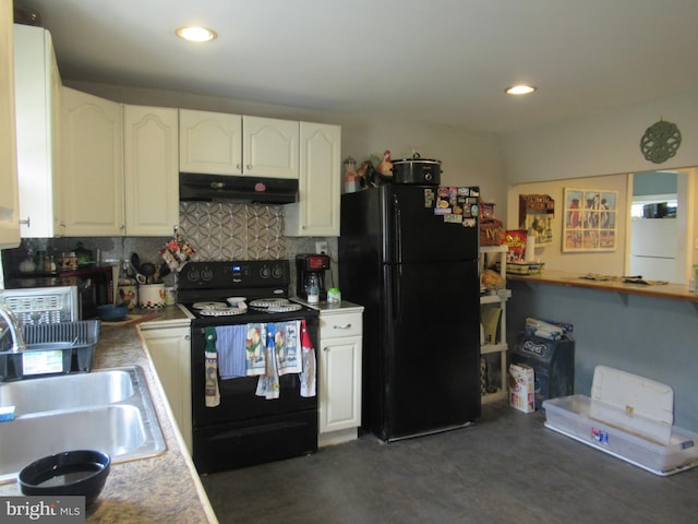 kitchen featuring sink, white cabinetry, and black appliances