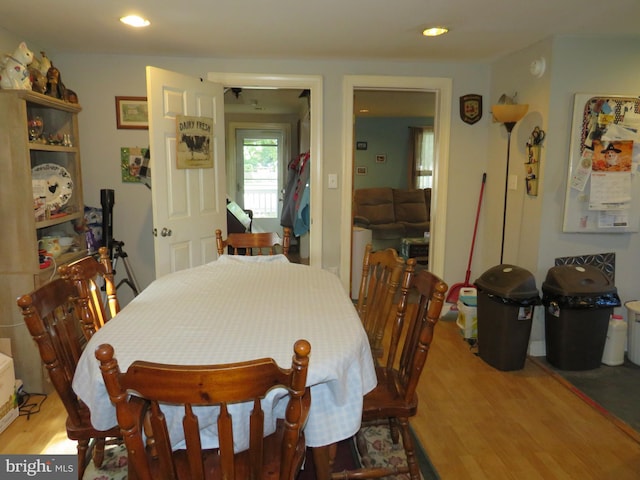 dining space with light hardwood / wood-style floors