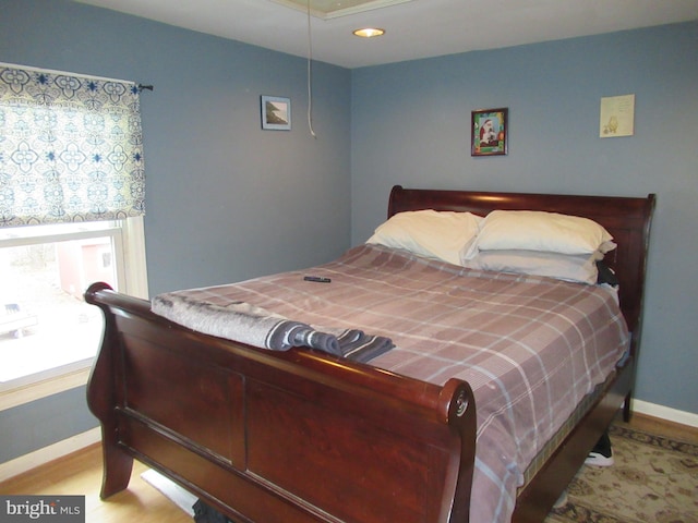 bedroom with light hardwood / wood-style flooring