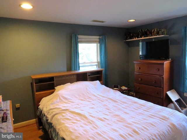 bedroom featuring hardwood / wood-style floors