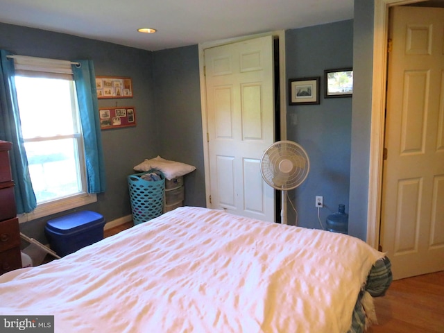 bedroom with hardwood / wood-style flooring