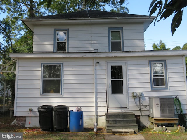 back of property with central air condition unit