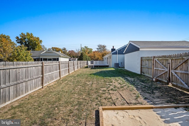 view of yard with central air condition unit