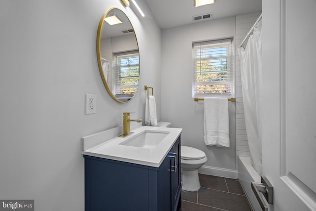 full bathroom with vanity, toilet, and shower / bath combo