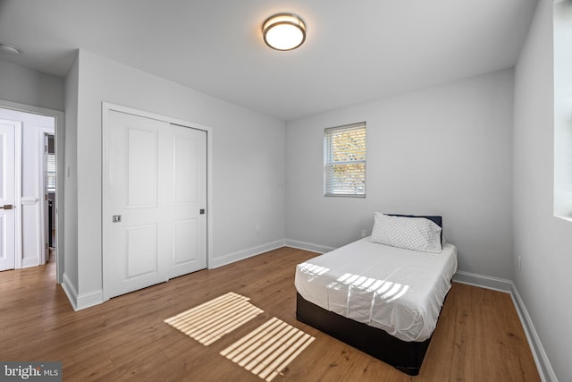 bedroom with wood-type flooring