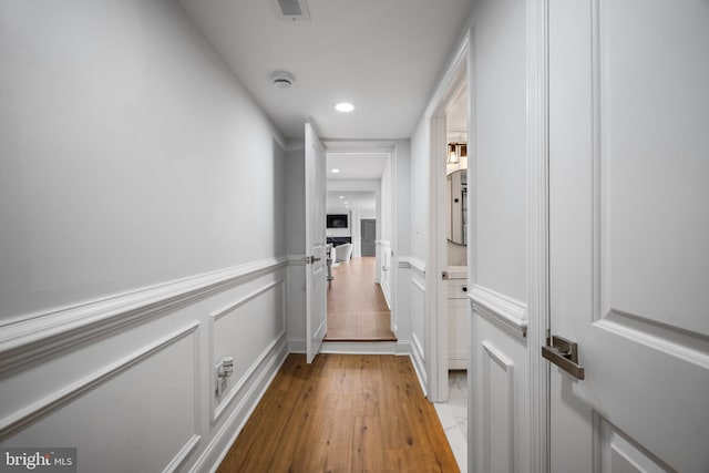 hallway with light wood-type flooring