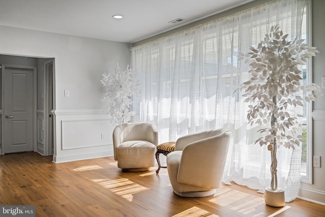 sitting room with hardwood / wood-style floors