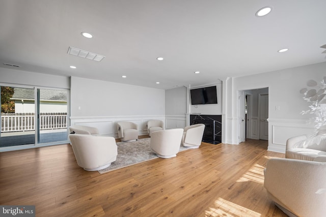 unfurnished living room with light hardwood / wood-style floors