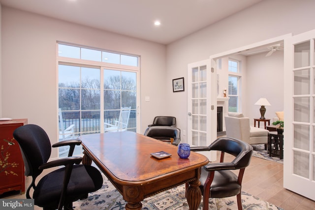 office space featuring french doors and light wood-type flooring