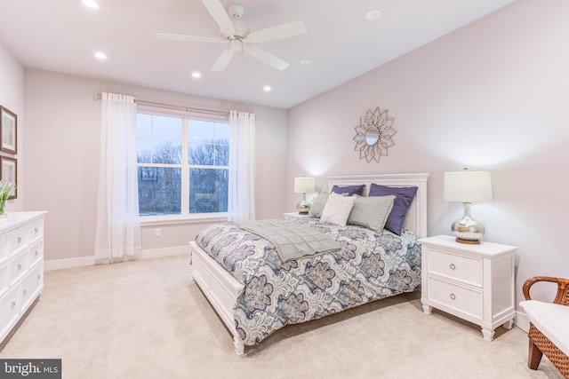 bedroom featuring ceiling fan and light colored carpet