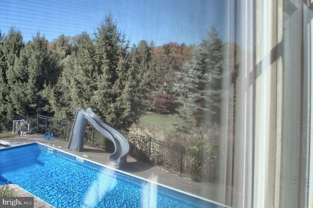 view of pool featuring a water slide