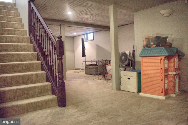 basement featuring carpet flooring