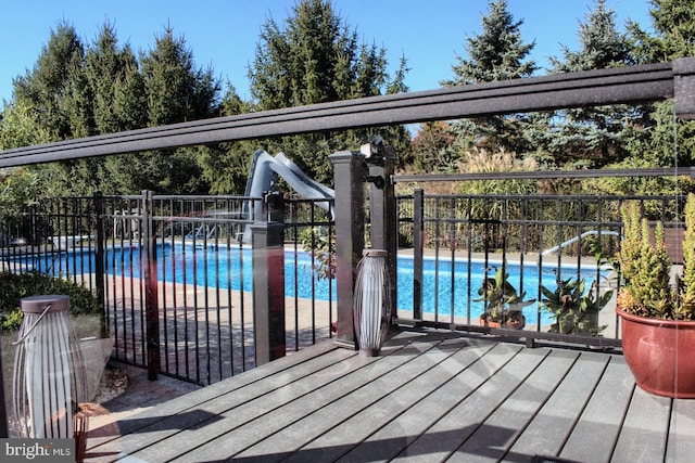 view of pool with a water slide