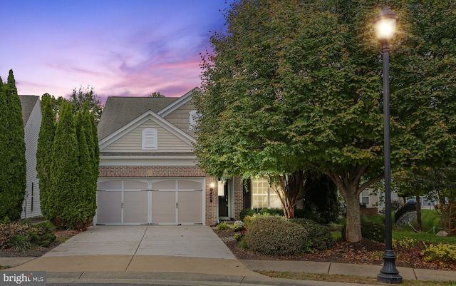 obstructed view of property featuring a garage