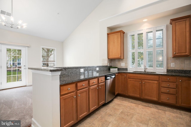 kitchen featuring backsplash, vaulted ceiling, dishwasher, kitchen peninsula, and light colored carpet