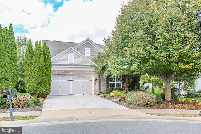 view of property hidden behind natural elements featuring a garage