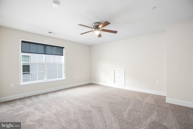 carpeted empty room with ceiling fan