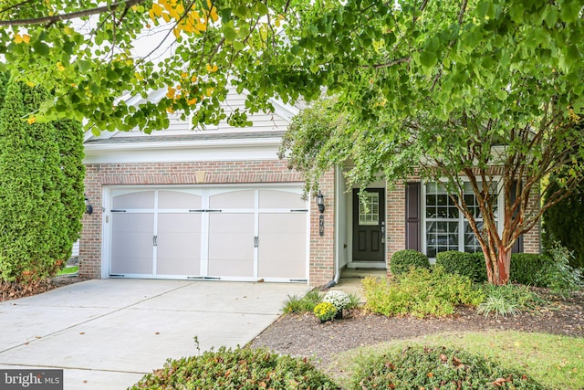 obstructed view of property with a garage