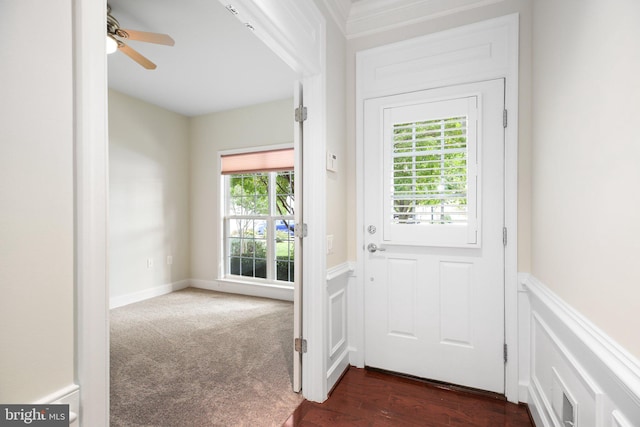 doorway to outside with dark colored carpet, plenty of natural light, and ceiling fan