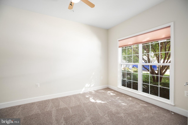 carpeted empty room with ceiling fan