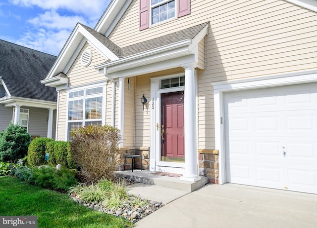 property entrance with a garage